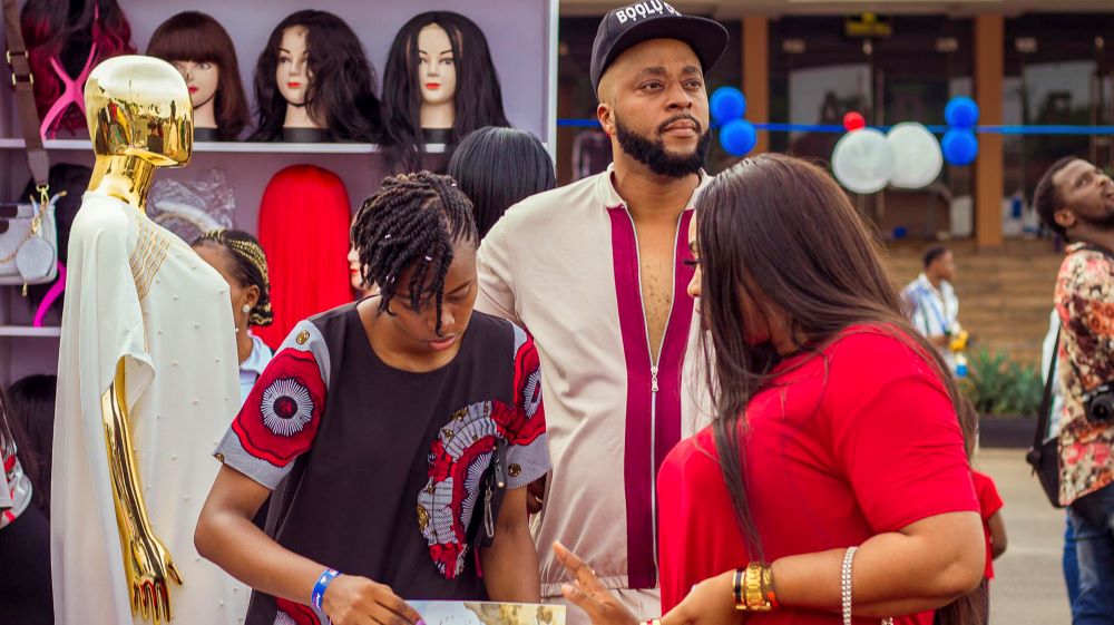 A customer patronising a business woman in her stall at Santa Fair Afrique, an annual trade fair that brings together women entrepreneurs to showcase a range of products and services to customers and visitors, in Enugu, Nigeria on April 21, 2025. Photo courtesy: Santa Fair Afrique